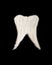 White tooth made of sugar. Refined granulated sugar depicting a human tooth. The concept of the harm of sweet food for teeth, the