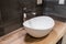White top ceramic washbasin with glossy metal mixer