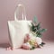 White tote bag mockup with flowers.