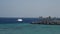 White tourist boat in the sea near reef