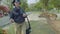 White tourists watch and feed deer in Khao Kheow Open Zoo