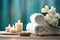 white towels, candles, and green flowers on a wooden table, in the style of light sky-blue and light brown, sensory experience