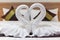 White towels folded into the shape of a pair of swans to symbolize love and fidelity are placed on the suite beds as towels