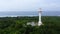 White tower lighthouse on a large island, top view.