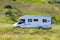 White travel van on road