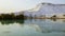 White travertine limestone mountain and its reflection in the la