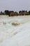 White travertine limestone mountain and terraces with ruins of H