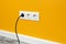 White triple outlet on yellow wall