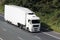 White truck on motorway in countryside