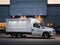 white truck parked in front of industrial logistics building at sunset. Logistics transport trucks are parked