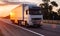 White truck with refrigerated semitrailer transport frozen food on the highway in the evening against the backdrop of