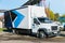 White trucker in the parking lot are waiting for the next delivery of goods. The concept of a transport company for the delivery