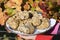 White truffles from Piedmont on tray held by the hands of a woman