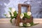 White tulips in a wooden trug