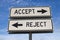 White two street signs with arrow on metal pole with word accept and reject