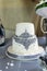 White two-tier wedding cake from the mastic with bead decor