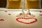 White two towel swans and red rose petals on the bed, Honeymoon decoration