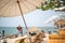 White Umbrella and chair on the beach for support traveler at Pattaya beach of Thailand. The outdoor soft sandy beach of  Pattaya