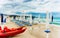 White umbrellas at La Cinta beach San Teodoro reflex