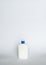 White unbranded bottle with a black dispenser isolated on white background. cosmetic packaging mockup with copy space