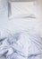 White unmade Bed mattress Duvet with pillow and blanket Top view
