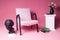 White upholstered chair on a pink background