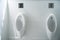 White Urinals in Men`s Toilet bathroom or restroom