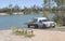 White Ute and Trailor at Boat Ramp.