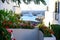 White vacation houses on Canary islands, tropical flora and flowers in winter, urban design in Spain