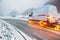 White van with fiery wheels on a snow covered road