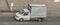 White van in motion on the city road shipping goods. Delivery van fast delivers in a city. Truck with an awning driving with