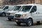 White vans parked inside warehouse