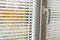 White Venetian blinds on a modern plastic window