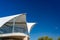 White veranda with fabric roof against blue sky