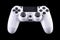 White video game joystick gamepad isolated on a black background