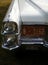 White vintage Chevrolet car with headlamp chrome and radiator detail
