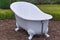 White vintage style bathtub in a garden