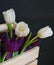 White and violet tulips wood box blossom inscription macro green spring mothers day nature decoration bouquet