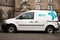 The white Volkswagen Caddy van car of the Scottish construction company John Dennis parked on a street