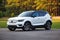 White Volvo Suv with a forest background during daytime