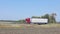 A white wagon drives along the highway in sunny weather. Truck on the highway