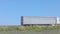 A white wagon drives along the highway in sunny weather. Truck on the highway