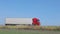 A white wagon drives along the highway in sunny weather. Truck on the highway