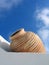 White wall, beige vase, blue sky, Santorini, Greece