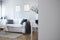 White wall blurred photo of beautiful studio apartment with small living room