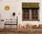 White wall with forge bench and wooden window