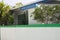 White wall with a green line of a maldivian house