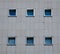 White wall with tiles and square windows - great for a cool background