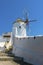 White walls, secluded alleyways and traditional windmills in the village of Oia, Santorini