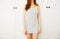 White Wardrobe. Beautiful Young Asian Woman Standing and Thinking at Home Room Background. Clothing, Fashion, Style and People